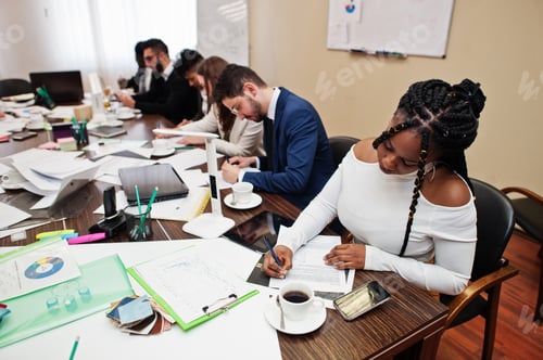 Preview: Multiracial young creative people in modern office