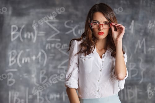 Preview: smart sexy woman in glasses near blackboard