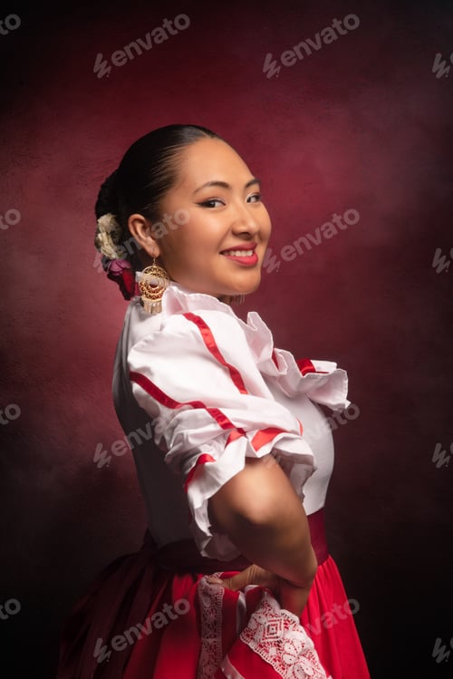 Preview: A woman in a red and white dress is smiling for the camera