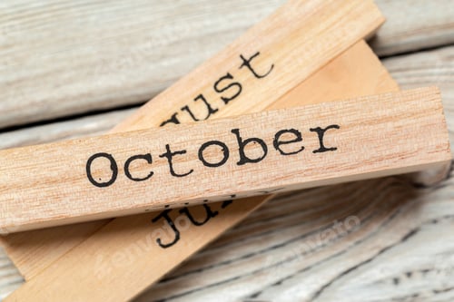 Preview: top view of parts of wooden calendar on dark wooden tabletop