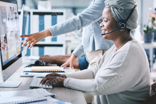 Preview: African american call centre telemarketing agent receiving training and assistance from supervisor