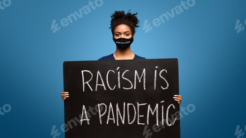 Preview: Black woman holding protest placard Racism is a Virus