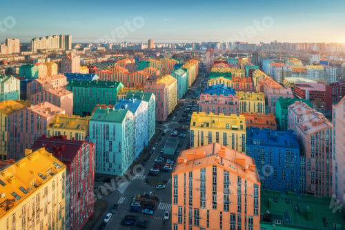 Preview: Aerial view of the colorful buildings in european city at sunset