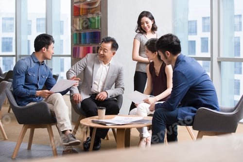 Preview: Business people talking in meeting
