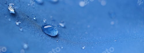 Preview: water beading on fabric. Waterproof coating background with water drops