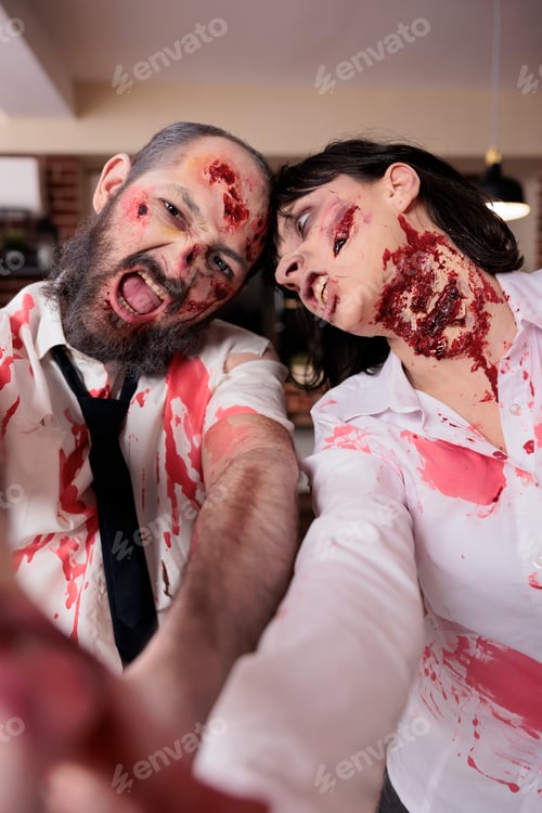 Preview: Actors having fun in office horror movie set dressed as zombies, taking selfies