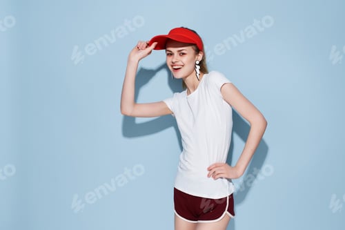 Preview: cheerful young woman in red cap fashion summer style Glamor studio