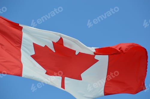 Preview: Canada flag against blue sky