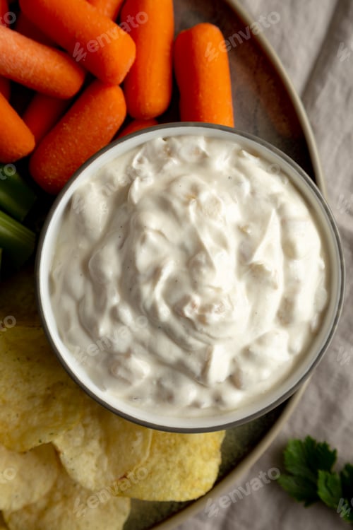 Preview: Homemade Carmelized Onion Dip with Baby Carrots, Chips and Celery, top view.