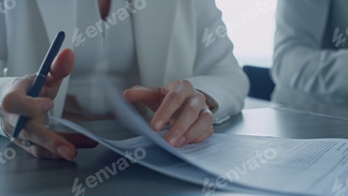 Preview: Lawyer hands holding papers closeup. Real estate manager meeting client office