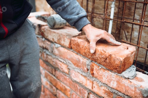 Preview: construction worker laying bricks and building walls on construction site