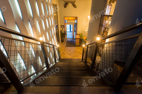 Preview: Stairs in modern restaurant to the first floor, creative wall