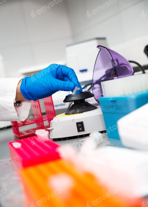 Preview: Close up of scientist hand during scientific experiment in laboratory.