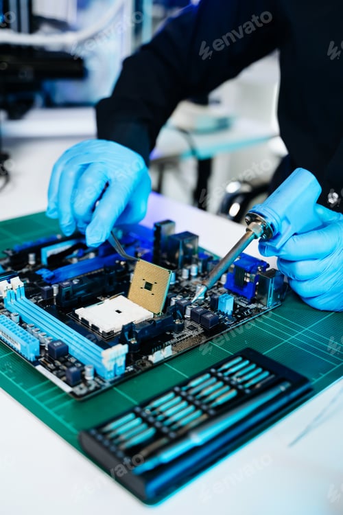 Preview: The technician is putting the CPU on the socket of the computer motherboard. electronic