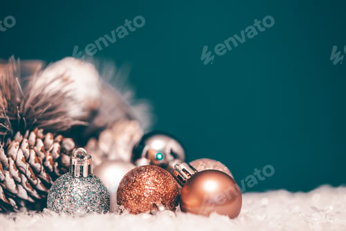 Preview: Christmas decorations with ball and fir branch in magic light.