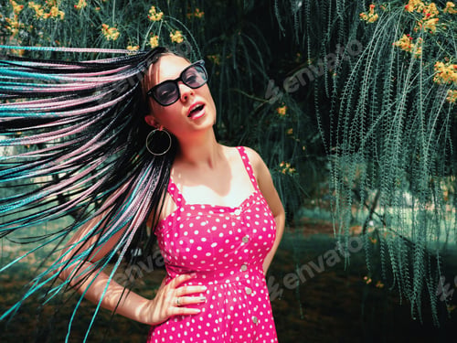 Preview: portrait of pretty woman in retro red polka dots dress smiling to camera