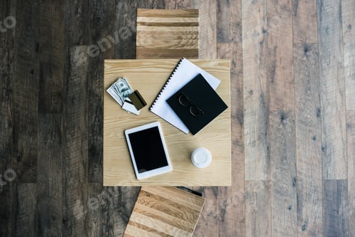 Preview: top view of business workplace on table in cafe