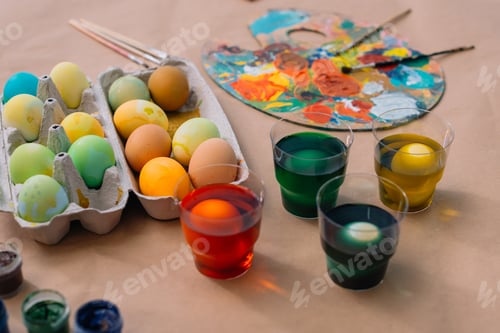 Preview: freshly painted easter eggs with paint on table