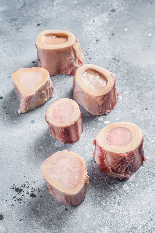 Preview: Raw calf Marrow bones on butcher table. Gray background. Top view
