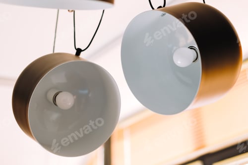 Preview: Black modern pendant lights in the kitchen. Home interior detail.