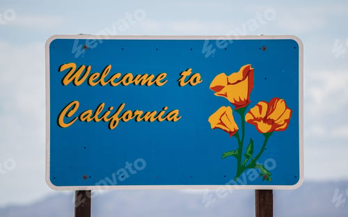 Preview: Welcome to California state sign in the foreground of a scenic highway, USA