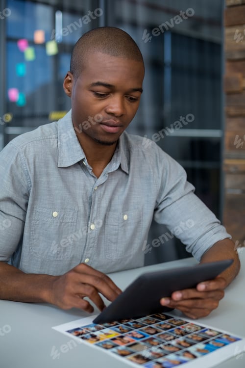 Preview: Male graphic designer using digital tablet