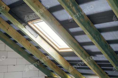 Preview: Unfinished attic wooden roof framing with vapor barrier, dormer and windows. New house constructio
