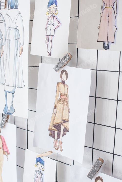 Preview: sketches of fashion outfit hanged on white checkered background