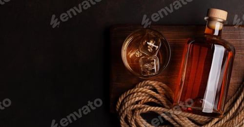 Whiskey Glass and Bottle on Rustic Wooden Tray
