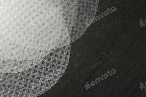Preview: Edible rice paper sheets on dark textured table, flat lay. Space for text