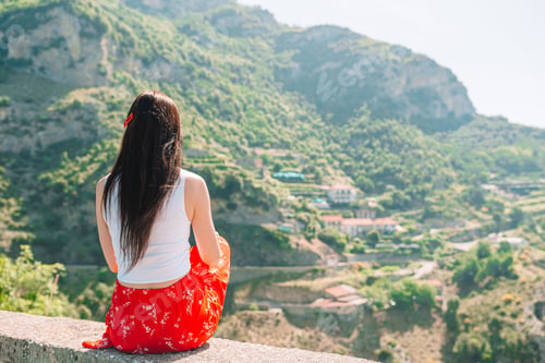 Preview: Summer holiday in Italy. Young woman in Positano village on the background, Amalfi Coast, Italy