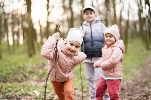 Preview: Three kids hiking and discovering spring forest. Happy childhood.