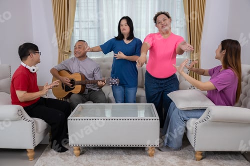 Preview: Autistic disabled children are having fun playing the guitar and singing with their families.