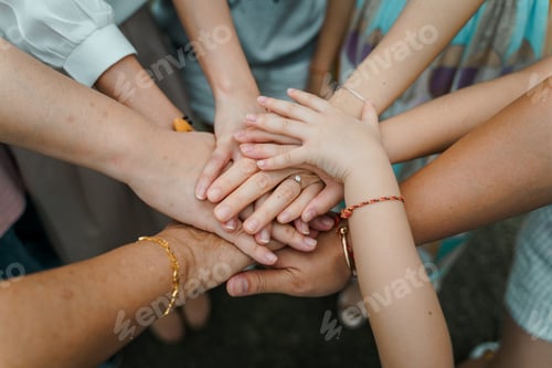 Preview: Family hands together on top of each other, together, teamwork