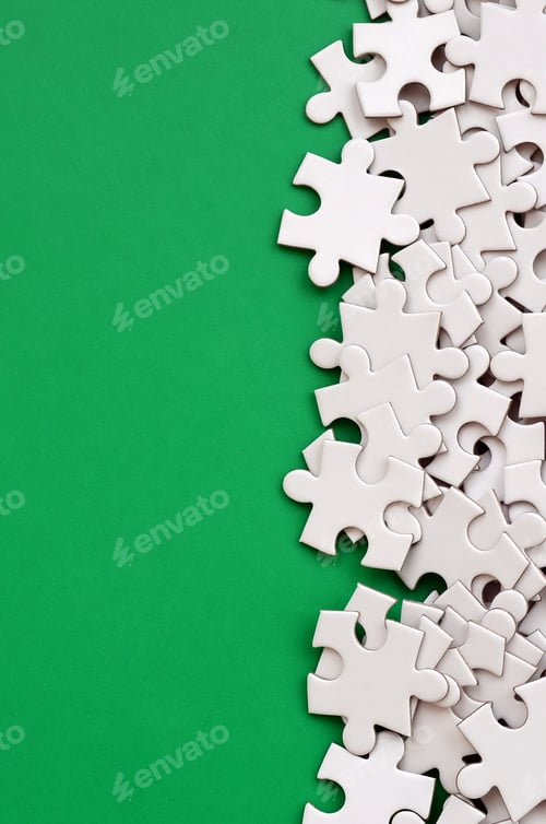 Preview: White Puzzle Pieces on a Green Background