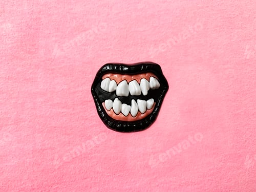 Preview: Toy Jaw With Crooked Teeth on Pink Background
