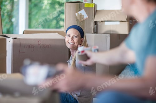 Preview: Moving house: couple packing cardboard boxes