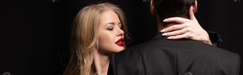 Preview: panoramic shot of attractive woman hugging man isolated on black