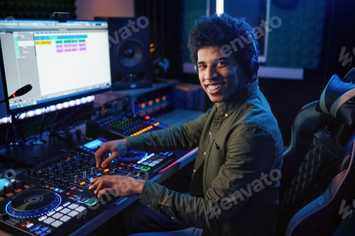 Preview: Portrait of radio host using sound mixer in studio