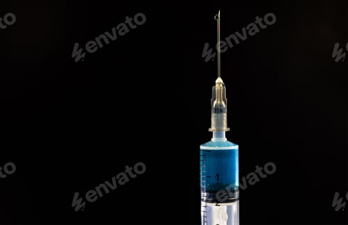 Preview: Closeup shot of a vaccine syringe on an isolated black background