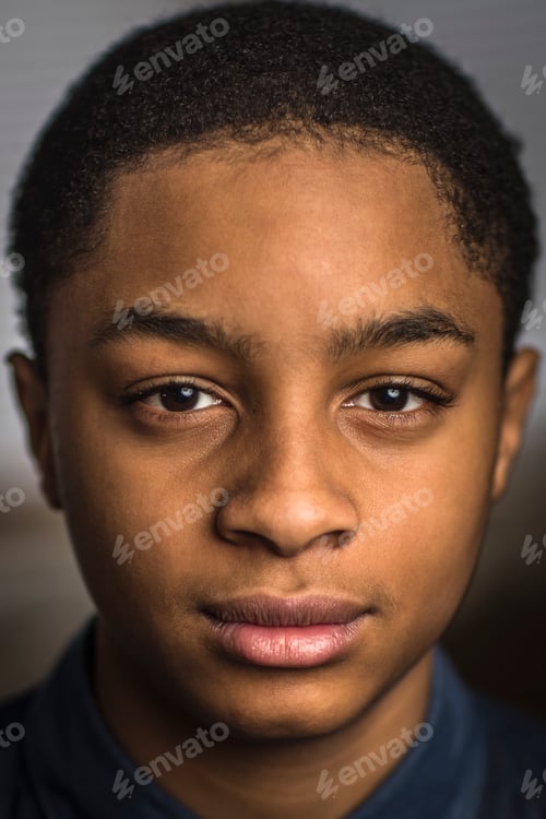 Preview: Close up portrait of serious teenage boy