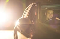 Preview: The happy man drive a car. evening night time