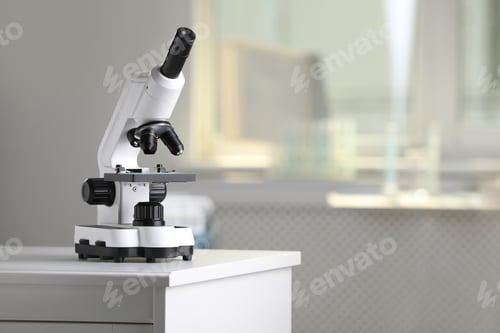 Preview: Modern medical microscope on lab drawer indoors, space for text. Laboratory equipment