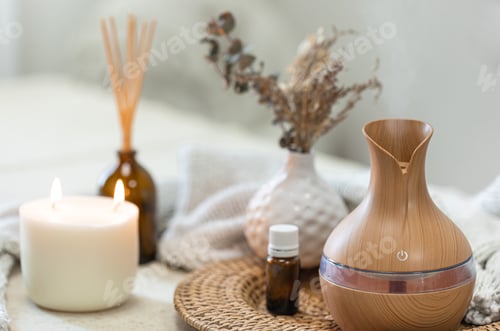 Preview: Spa composition with aroma oil diffuser lamp on a blurred background.