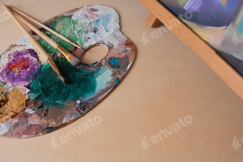 Preview: artist's palette and brushes with copy space for your creative ideas