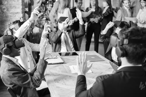 Preview: Group of workers testing virtual reality in the office - black and white