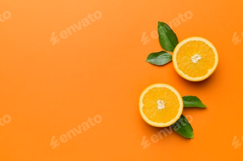 Preview: fresh Fruit orange slices on colored background. Top view. Copy Space.