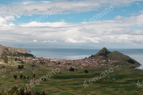 Preview: Cityscape of copacabana, bolivia showing the urban sprawl nestled between the agricultural fields