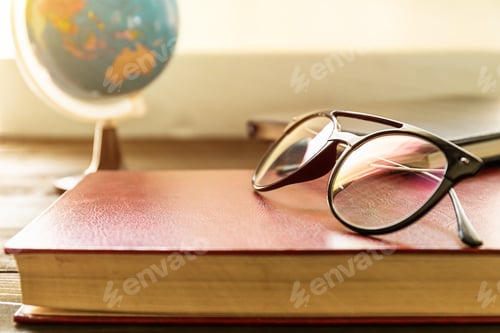 Preview: Eye glasses and books beside the window-3