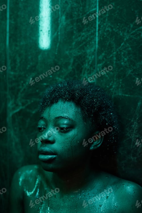 Preview: African woman standing in shower